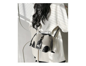 beige bucket bag with black accents