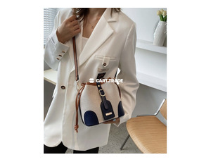 beige and navy blue handbag